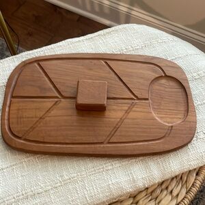 Vintage teak Dolphin wood meat cutting board with prongs and cover.